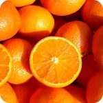 Juicy, bright orange Sweet Orange fruits, celebrated for their refreshing and energising scent